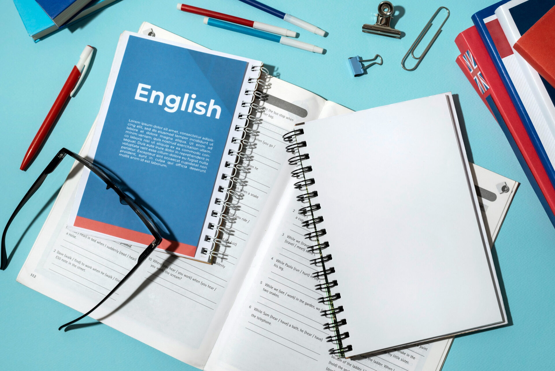 English test preparation book and study materials on table for IELTS and PTE exams
